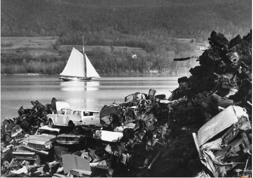 The Clearwater, a sloop built to promote the antipollution cause, is sailing down the Hudson river past a junkyard on its way to the first Earth Day activities in 1970. (© Bettmann/Corbis. Reproduced by permission.)