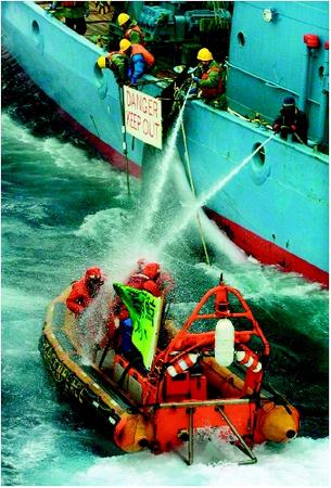 Crew of the Japanese whaling ship Kyo Maru 1 using water cannons to disperse activists during an antiwhaling demonstration in the waters of the Antarctic Ocean, December 16, 2001. (© AFP/Corbis. Reproduced by permission.)