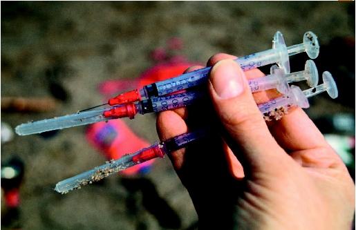 Three syringes found on a beach in New London, Connecticut. (©Todd Gipstein/Corbis. Reproduced by permission.)