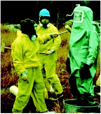 A worker is undergoing a decontamination process.  (U.S. EPA. Reproduced by permission.)