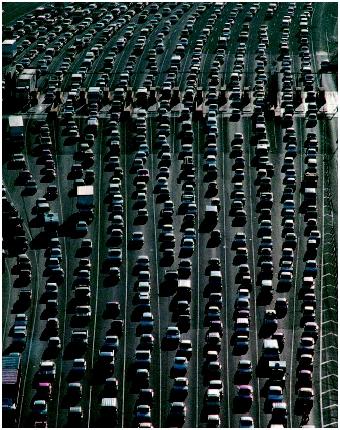 Morning rush hour traffic waiting to pay the toll to cross the Oakland Bay Bridge in August 1989. (©James A. Sugar/Corbis. Reproduced by permission.)